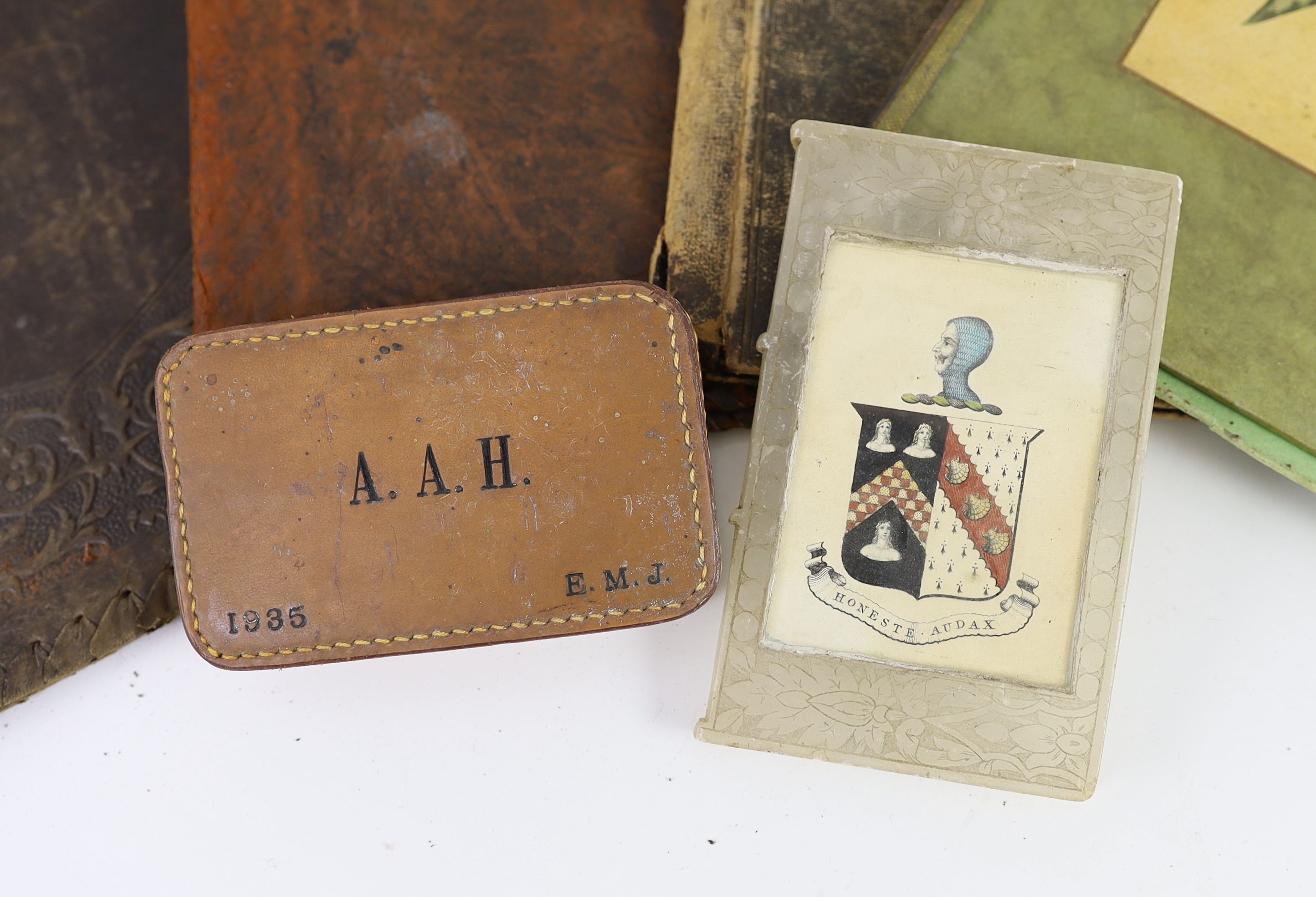 A soapstone and armorial paperweight in the form of a book